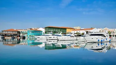 a group of boats are docked in a harbor at Oceanside Living - Modern 1 bedroom in Limassol