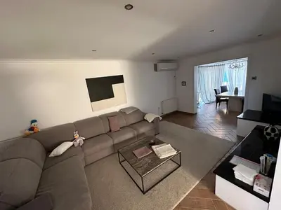 a living room with a couch and a table at Modern house in Larnaca in Larnaka