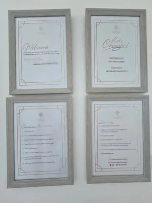 four framed diplomas and certificates on a wall at Lazuli Beachfront Sea View Ap 34 in Larnaka