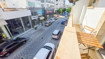 an aerial view of a city street with cars parked at Citycenter Comfy Apartment in Larnaka
