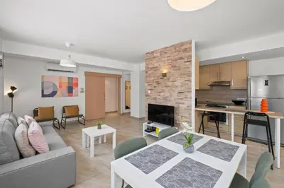 a living room with a couch and a table at Giorgio Downtown 2 Bedroom Apartment in Larnaka