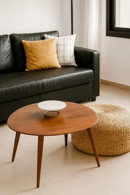a coffee table in a living room with a couch at Larnaca Seaview Apartment with pool & parking in Larnaka