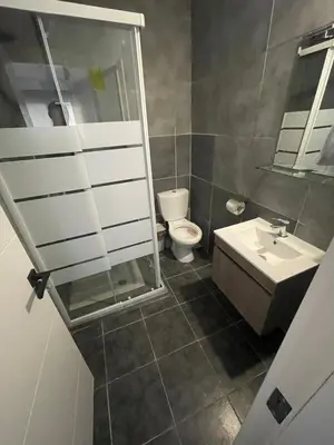 a bathroom with a toilet and a sink at Azure Waves House in Voroklini