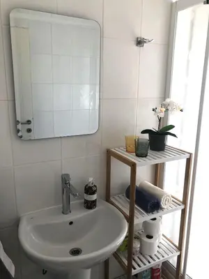 a bathroom with a sink and a mirror at Flat in Kyrenia, Cyprus in Kérynia