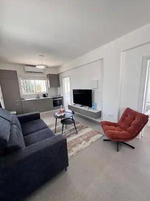 a living room with a couch and a table at Dhekelia Beach house - Pyla, Larnaca in Pyla
