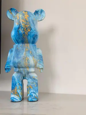 a blue teddy bear statue sitting on a table at Dhekelia Beach house - Pyla, Larnaca in Pyla