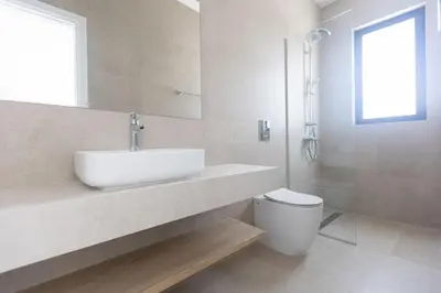 a white bathroom with a sink and a toilet at Ayia Napa Orea Villa OR9 in Ayia Napa
