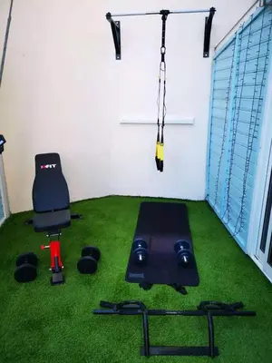 a room with a chair and a swing at Nestia Apartment in Yermasoyia