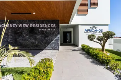 a building with a sign that reads antiguay view reserves at Densho 2-Bedroom Luxury Apartment in Larnaka