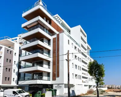 an apartment building with balconies on a street at Itero 2-Bedroom Luxury Apartment in Larnaka
