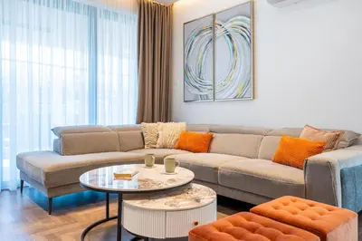 a living room with a couch and a table at Itero 2-Bedroom Luxury Apartment in Larnaka