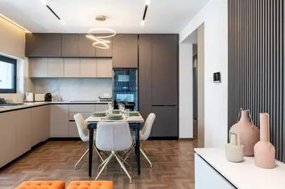 a kitchen and dining room with a table and chairs at Itero 2-Bedroom Luxury Apartment in Larnaka