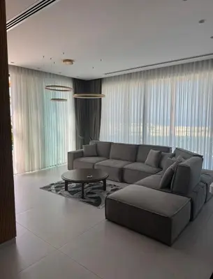 a living room with a couch and a coffee table at Mykonos Homes Villa in Aglantzia