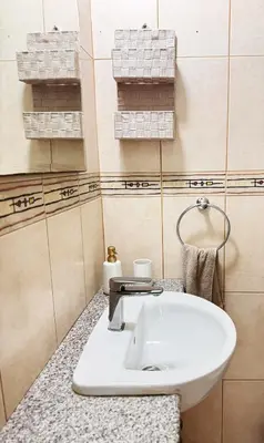 a bathroom with a white sink on a counter at Stay in Harmony in Paralimni