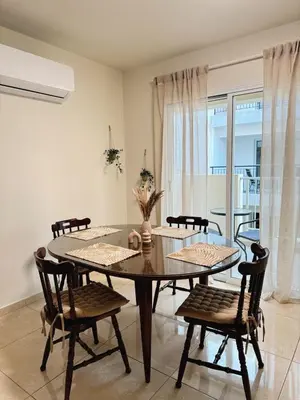 a dining room with a table and chairs at Stay in Harmony in Paralimni