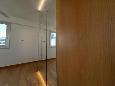 a room with a glass wall and a wooden floor at The C Suite - Business & Leisure in Nicosia in Nicosia