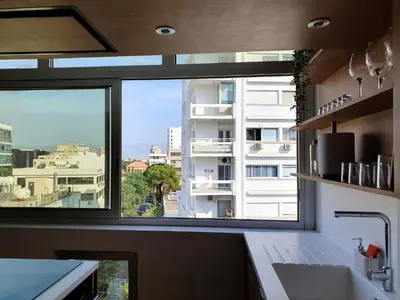 a kitchen window with a view of a building at The C Suite - Business & Leisure in Nicosia in Nicosia