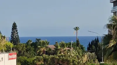 a view of the ocean from a building at Brand new sea view walking distance to the sea 200m in Limassol