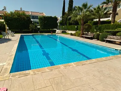 a large swimming pool with a blue at Brand new sea view walking distance to the sea 200m in Limassol