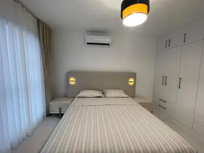 a bedroom with a large bed in a room at Penthouse Blueberry North Cyprus in Kérynia