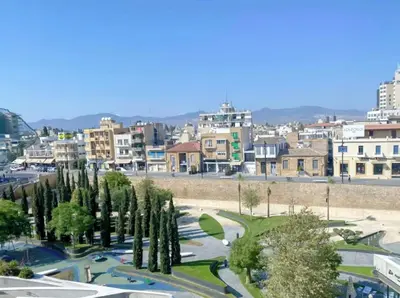 a city with a bunch of trees and buildings at Plateia suite Grigio in Nicosia