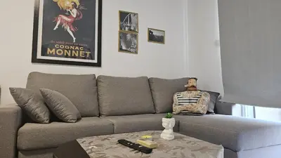 a living room with a couch with a doll sitting on it at STAY ZEA Studio in Ayia Napa