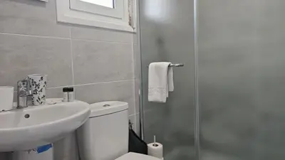 a bathroom with a toilet and a sink and a shower at STAY ZEA Studio in Ayia Napa