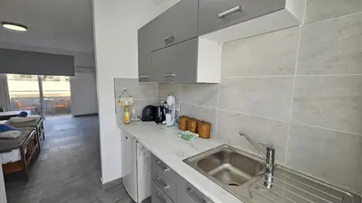 a kitchen with a sink and a counter top at STAY ZEA Studio in Ayia Napa