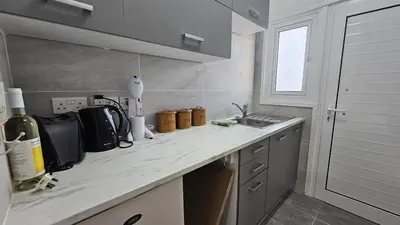 a kitchen with a sink and a counter top at STAY ZEA Studio in Ayia Napa
