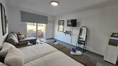 a living room with a bed and a couch at STAY ZEA Studio in Ayia Napa