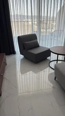 a living room with a couch and a table at Grand Sapphire 22 floor B BLock 377, Cypr Północny in Paralimni