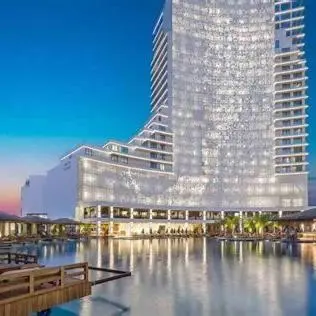 a large building with a reflection in a body of water at Grand Sapphire 22 floor B BLock 377, Cypr Północny in Paralimni
