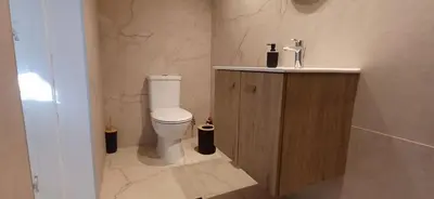 a bathroom with a toilet and a sink at Jay's Nest in Larnaka