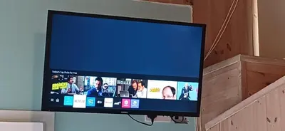 a flat screen tv hanging on a wall at Jay's Nest in Larnaka