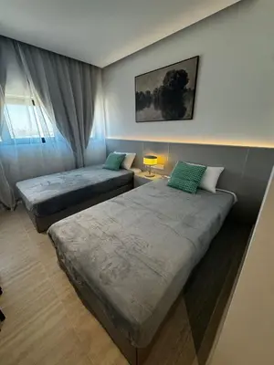 a bedroom with two beds and a window at AppleGym sports centre in Laxia