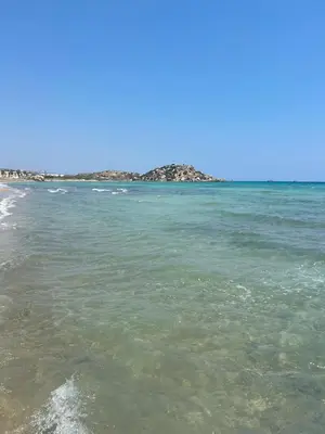 a body of water with rocks in the distance at Sunrise Beach Club, Bogaz, North Cyprus in Boğaz