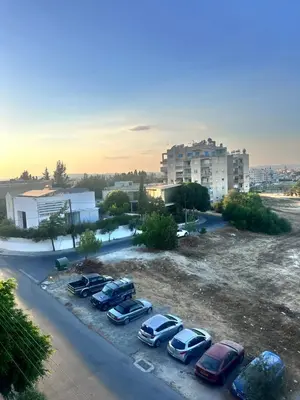 a group of cars parked in a parking lot at Faneromeni 33 in Scala