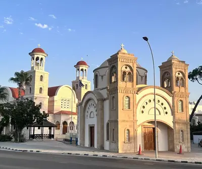 a large building with two towers on a street at Faneromeni 33 in Scala