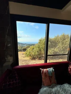 a large window with a view of the ocean at Chardonnay Tiny Home for Nature Lovers North Cyprus in Kérynia