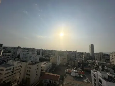 a view of a city with the sun in the sky at Premium City Center 10th Floor Sky View -Suite 103 in Nicosia