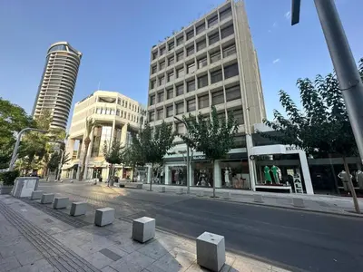 a city street with tall buildings on a sunny at Premium City Center 10th Floor Sky View -Suite 103 in Nicosia