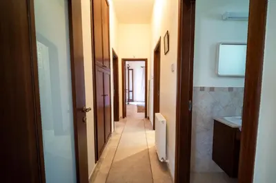 a corridor of a hallway with at Casa Harmonia Traditional Stone House, Escape to Silence Soul and Serenity in Nature with 2 Bedrooms, Fireplace and Mountain Breeze in Mandria