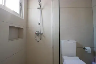 a bathroom with a shower with a toilet and a shower at Sea View Stay 200m to Beach in Voroklini