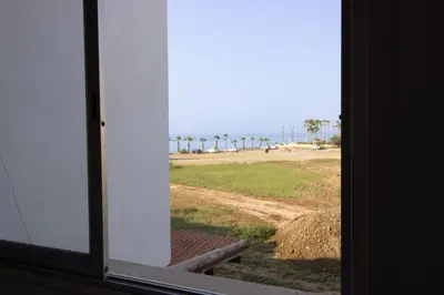 an open window with a view of a field at Sea View Stay 200m to Beach in Voroklini