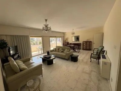 a large living room with couches and a table at Sfina Sea view apartment by Ezoria villas in Limassol