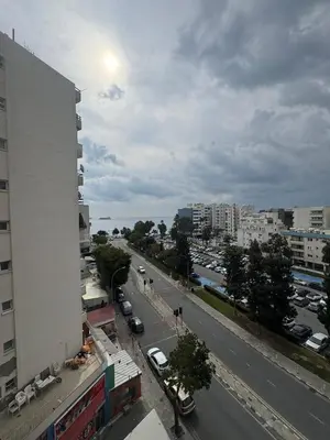a view of a city with a building and a street at 3 bedroom seafront apartment in Limassol