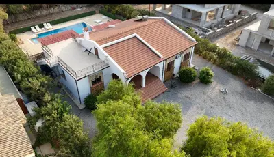 an aerial view of a house with a swimming pool at A Spacious Villa to Entertain in Aglantzia
