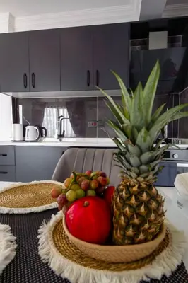 a bowl of fruit on a table with a pineapple at Apartment Northern Cyprus