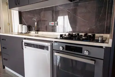 a kitchen with a stove and a sink at Apartment Northern Cyprus