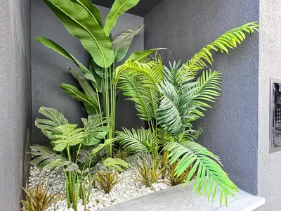 a group of plants sitting on a wall at SWIFT Suites Limassol in Limassol